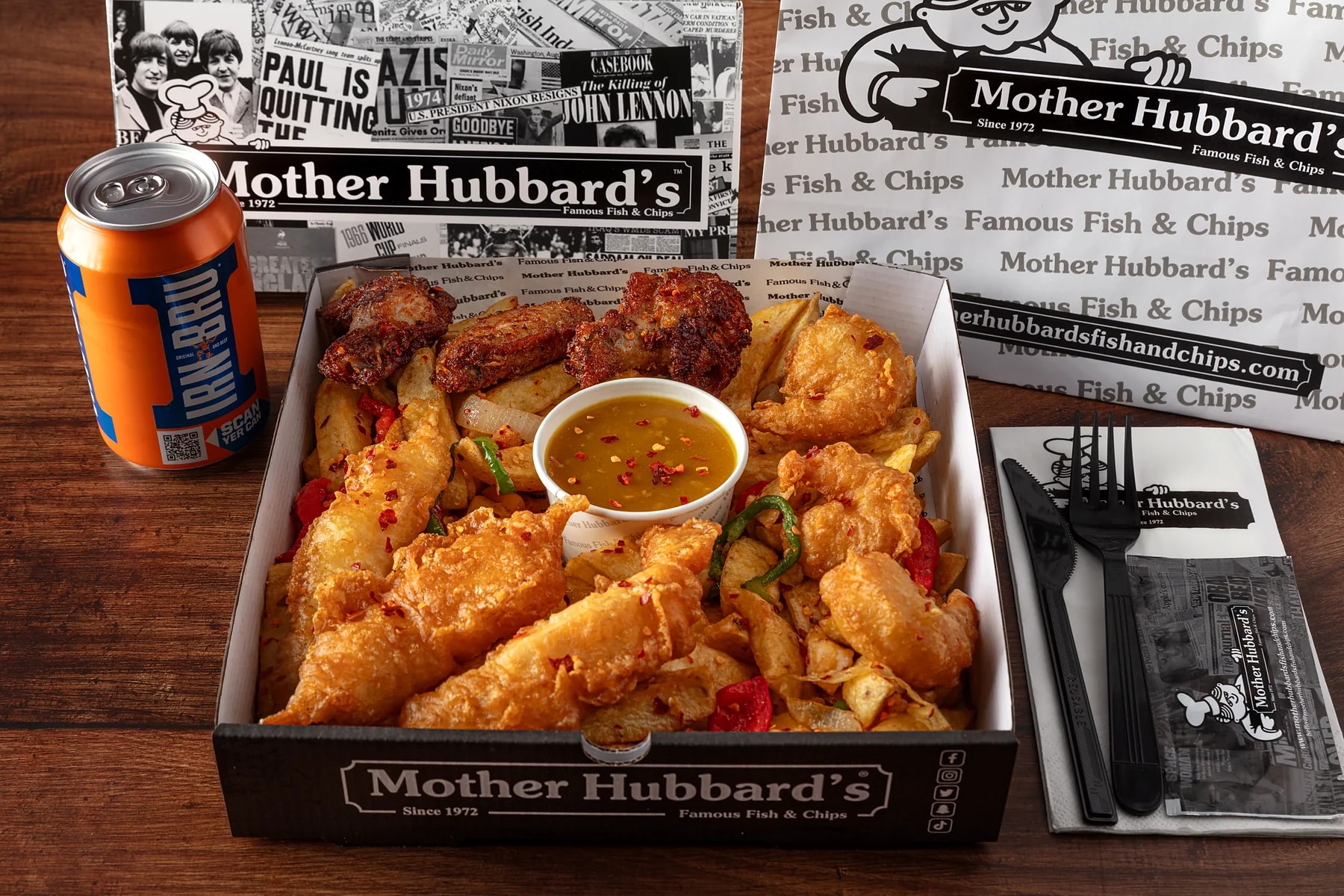A loaded box of salt and pepper chicken, chips and dip