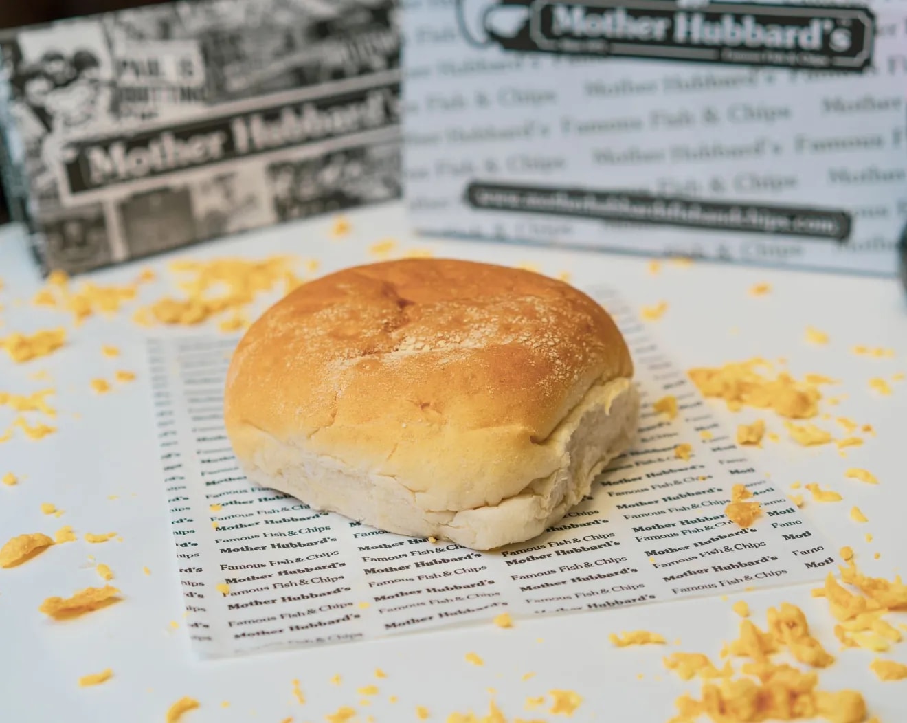 A soft white teacake on Mother Hubbard’s printed paper
